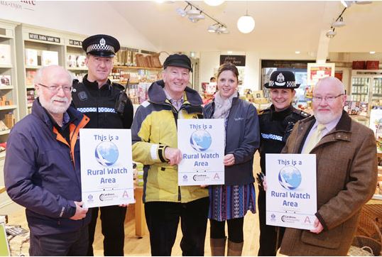 Neighbourhood Watch members including residents, police, and emergency services working together in the community